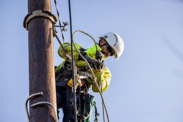 engineers inspecting a damaged power station after a storm