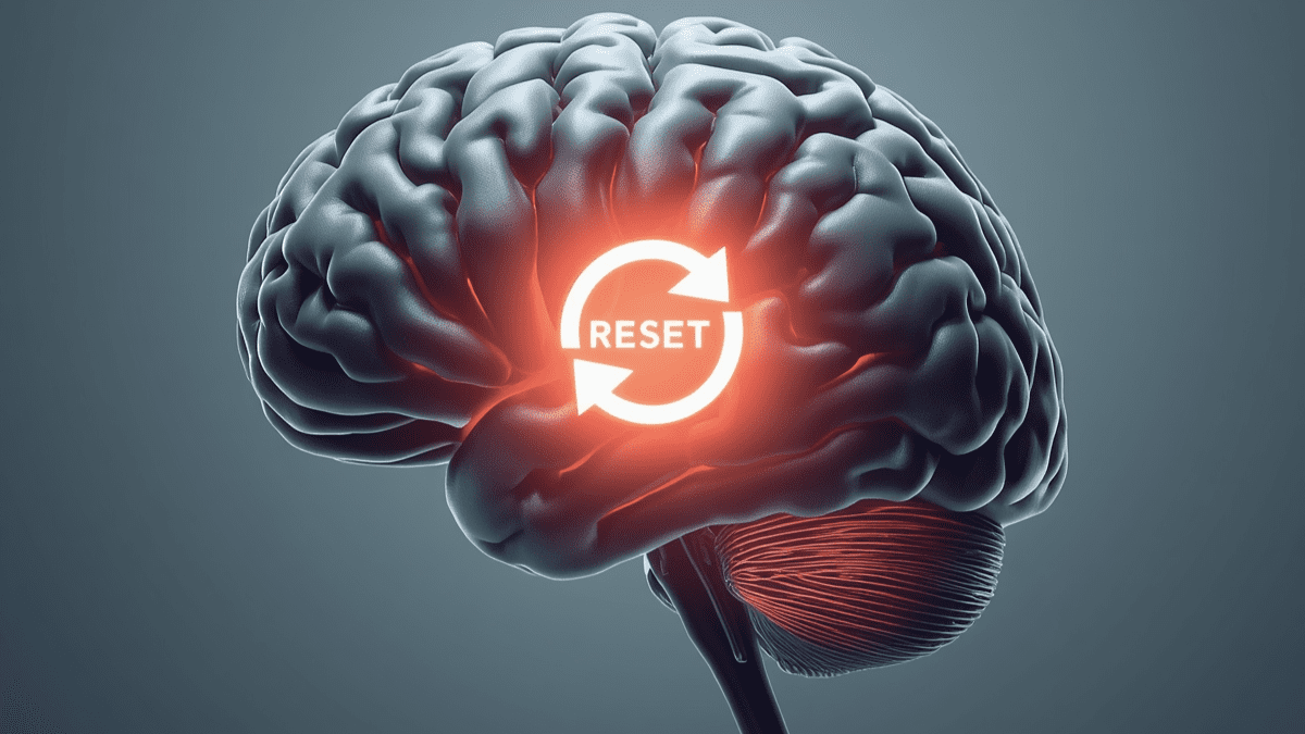 Ilustração de um cérebro com um botão de reset, simbolizando a técnica do reset mental para recuperar o foco e a clareza.
